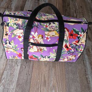 Retro style tropical pin-up girl print duffle bag.